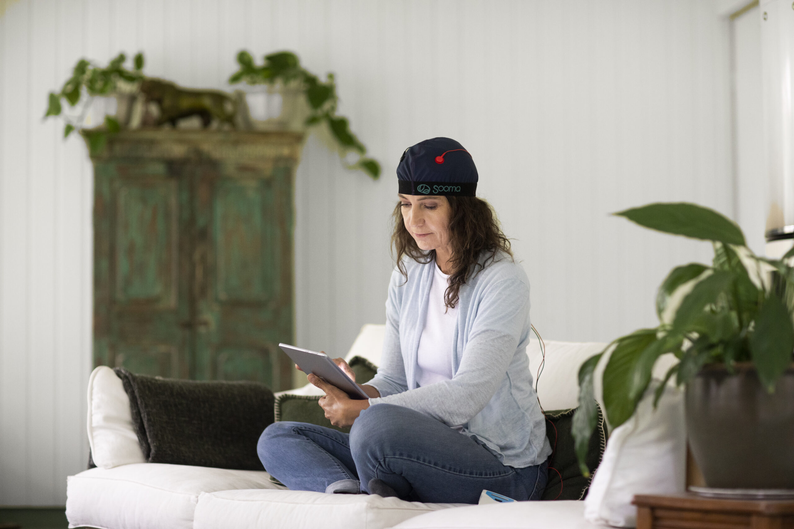 A patient receiving a session of Sooma Therapy at home