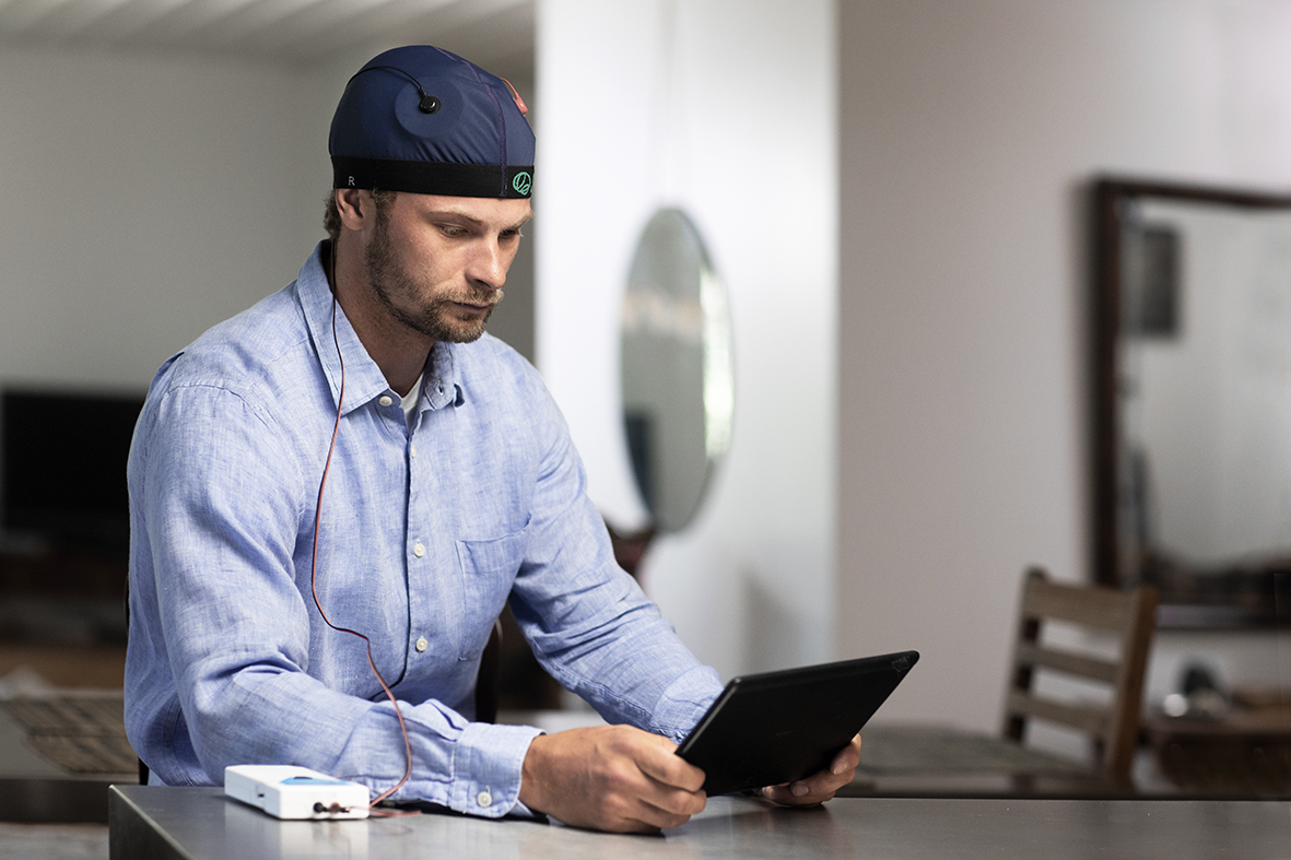 Man receiving a tDCS therapy session at home